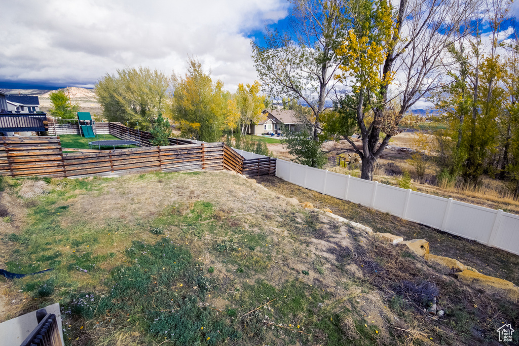 View of yard with fence