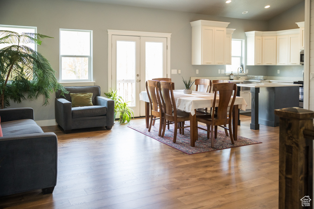 Dining area featuring recessed lighting, french doors, and wood finished floors
