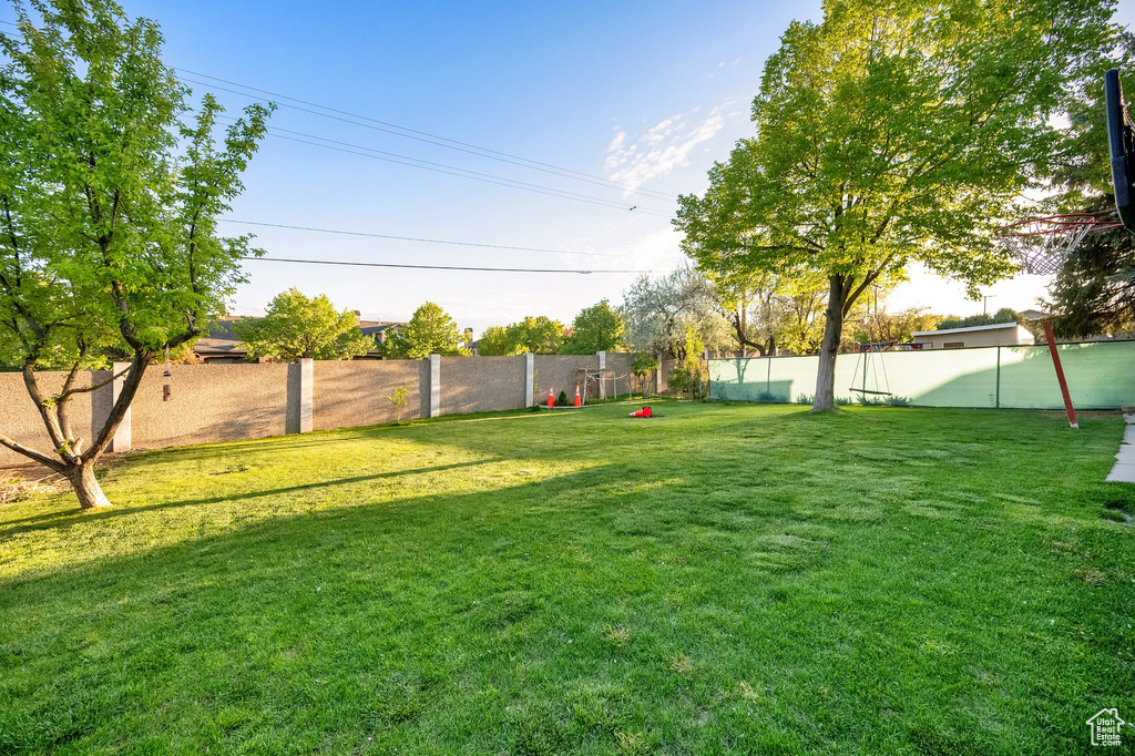 View of yard featuring fence