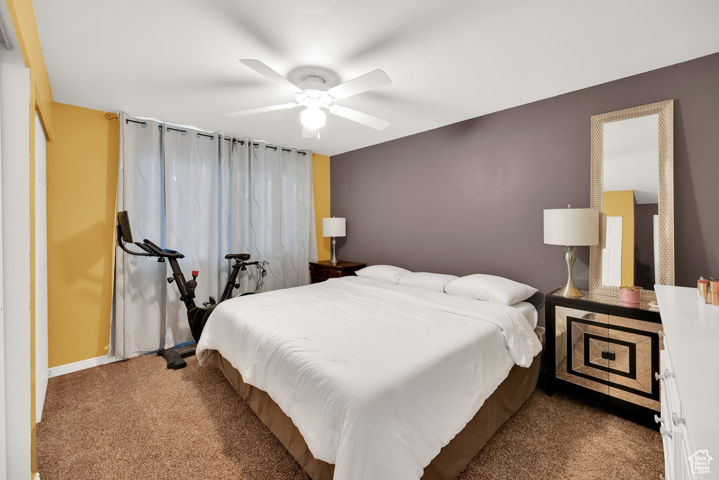 Bedroom with baseboards, carpet, and ceiling fan