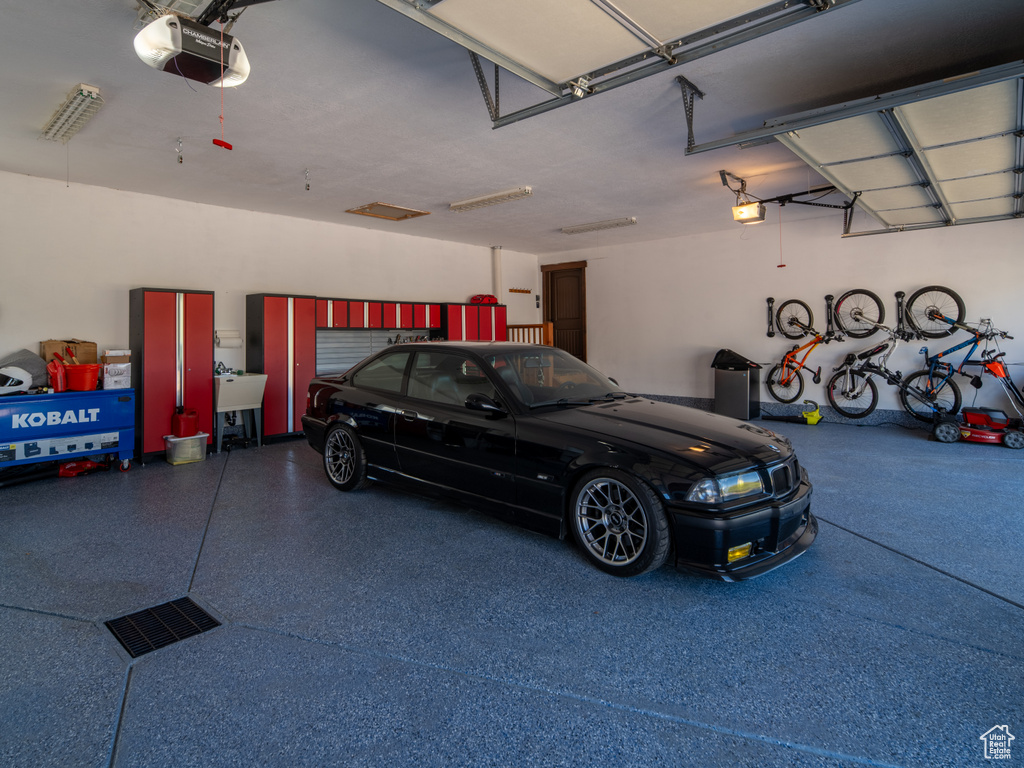 Garage featuring a garage door opener
