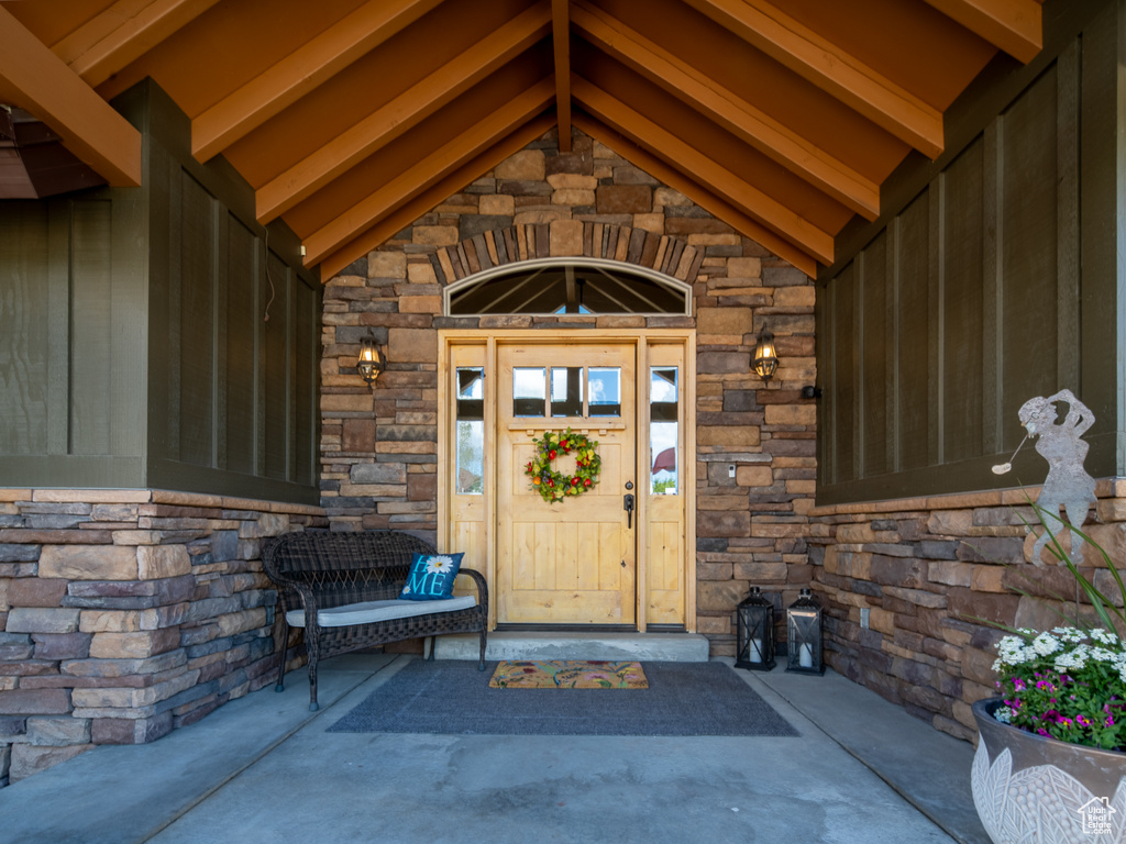 Entrance to property with stone siding