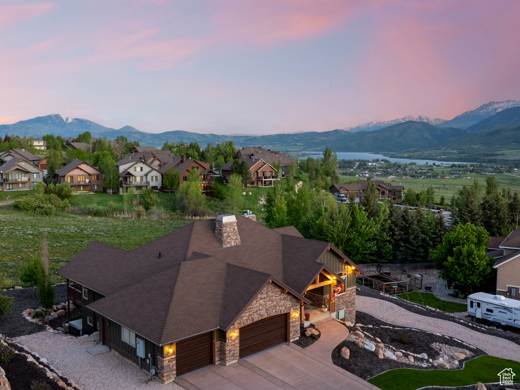 Aerial perspective of suburban area with a mountain backdrop