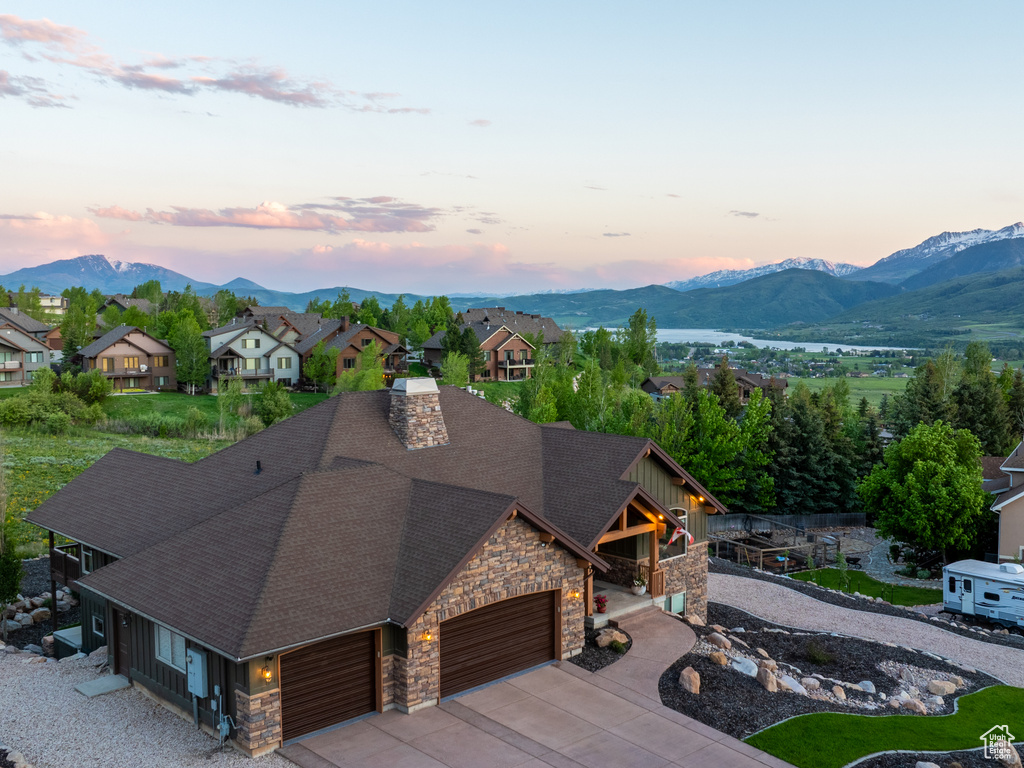 Aerial perspective of suburban area featuring a mountain backdrop
