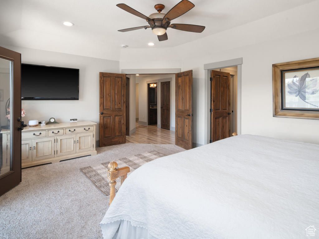 Bedroom featuring light carpet, a ceiling fan, and recessed lighting