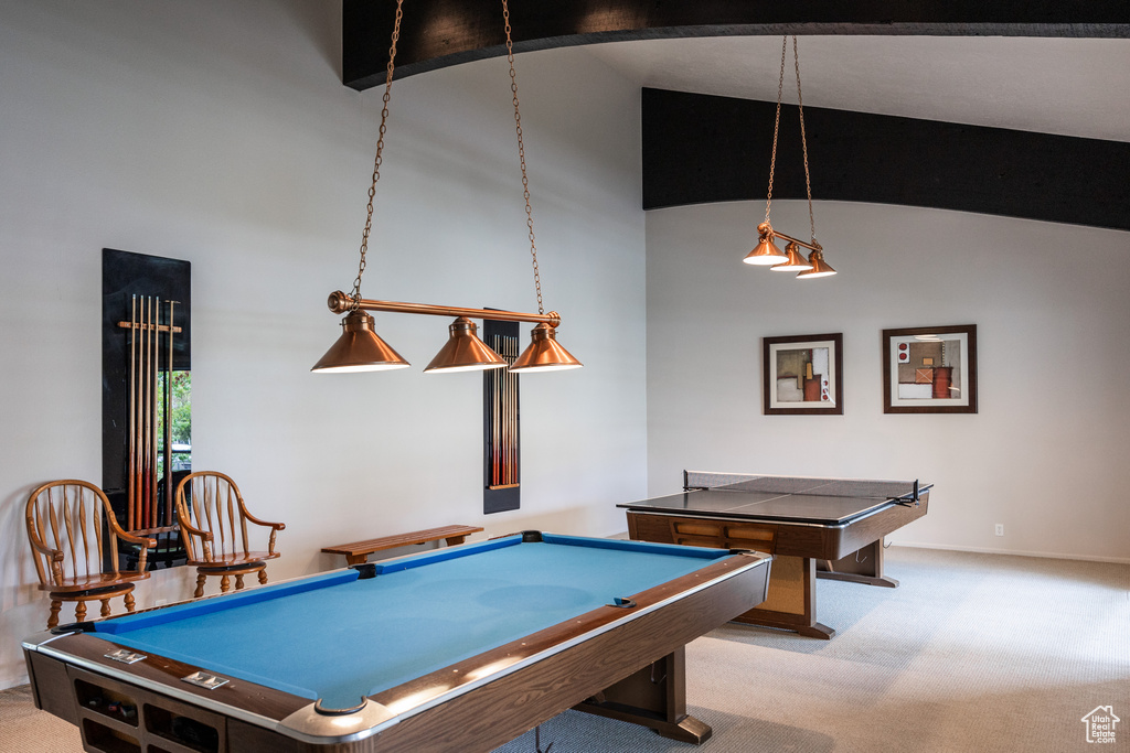 Recreation room featuring carpet floors, billiards, baseboards, and vaulted ceiling