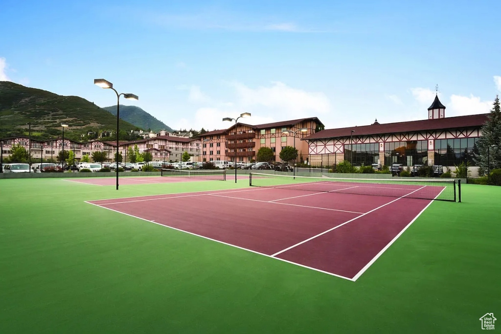 View of sport court with fence, community basketball court, and a mountain view