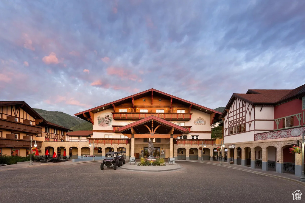 View of property at dusk