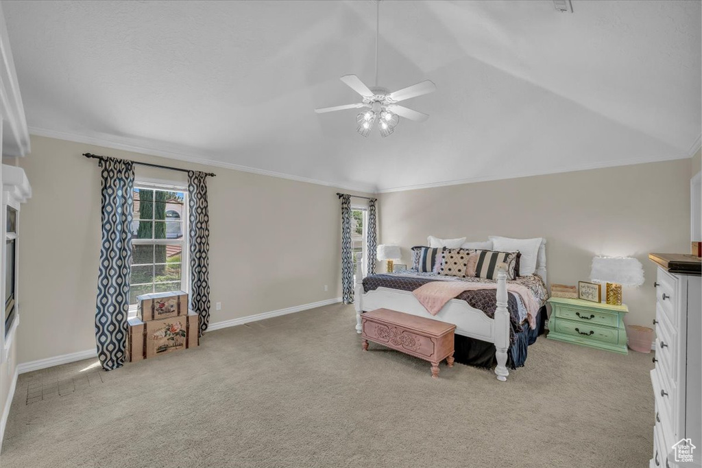 Bedroom with baseboards, ornamental molding, and carpet