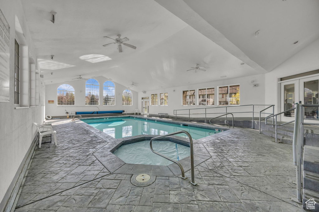 View of pool with ceiling fan, french doors, and a covered pool