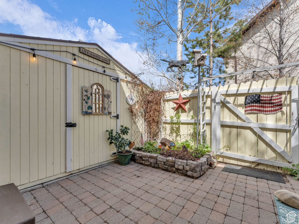 View of patio featuring fence