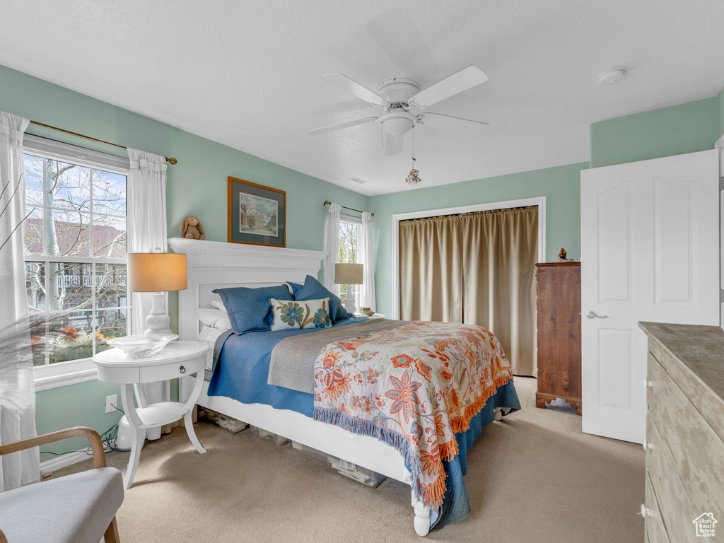 Bedroom with carpet floors and ceiling fan