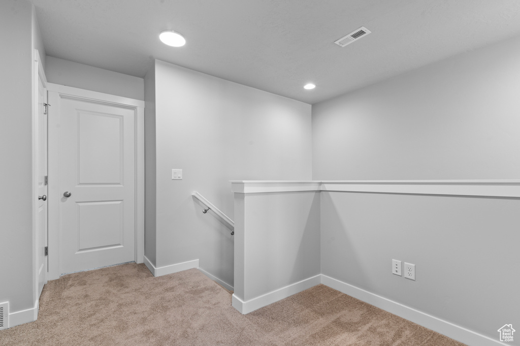 Walk in closet with carpet and visible vents