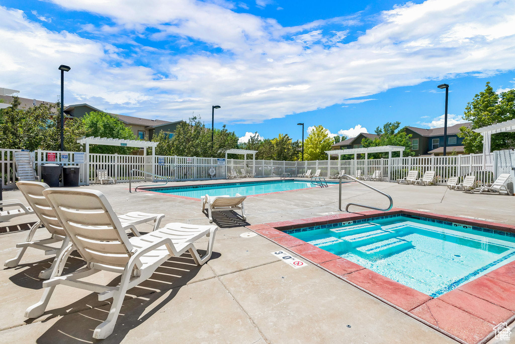 Pool featuring a patio area and fence