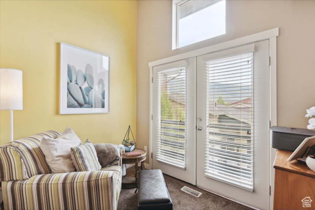Interior space with carpet, french doors, and visible vents
