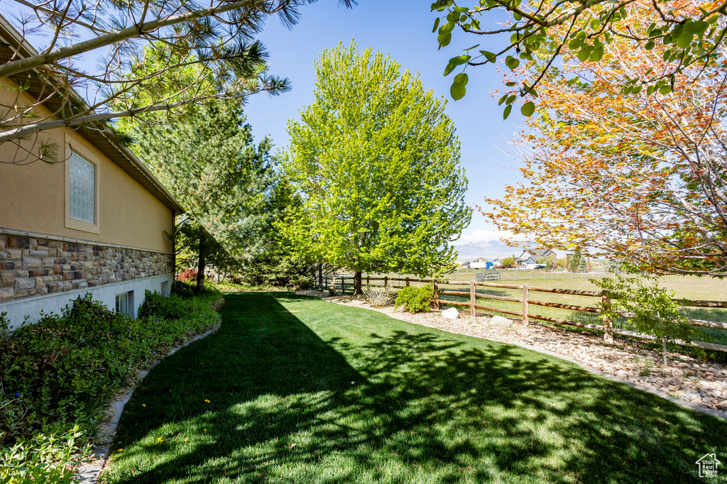 View of yard with fence