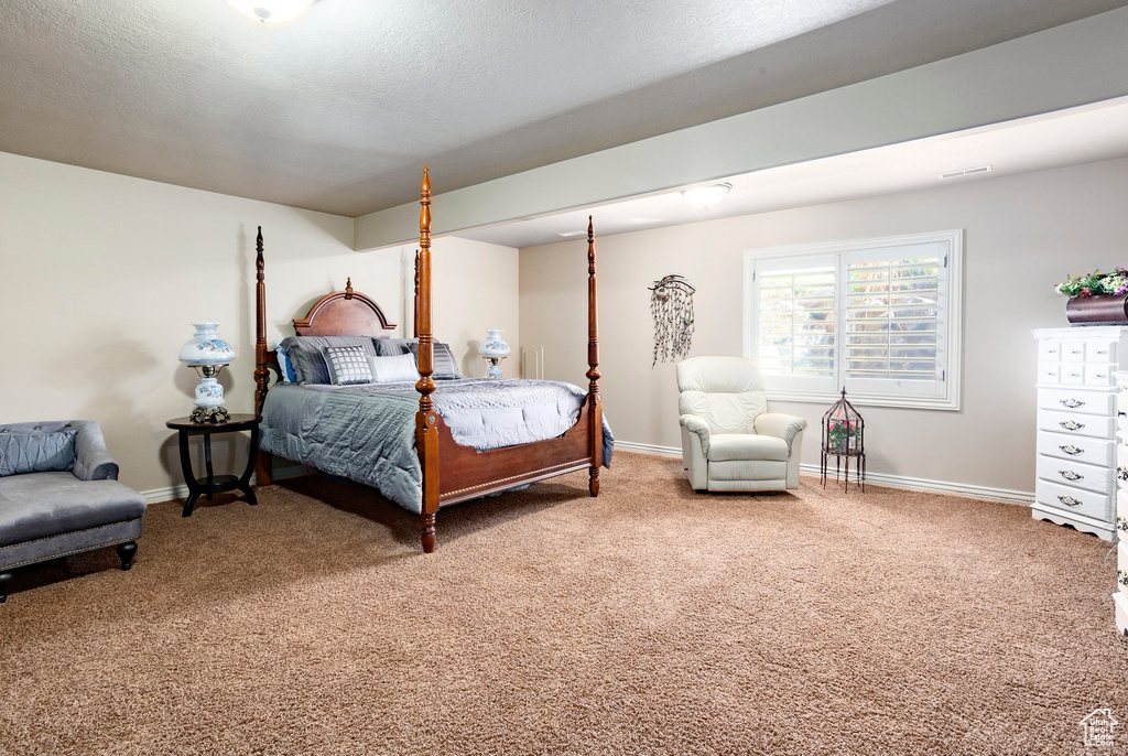 Carpeted bedroom with baseboards