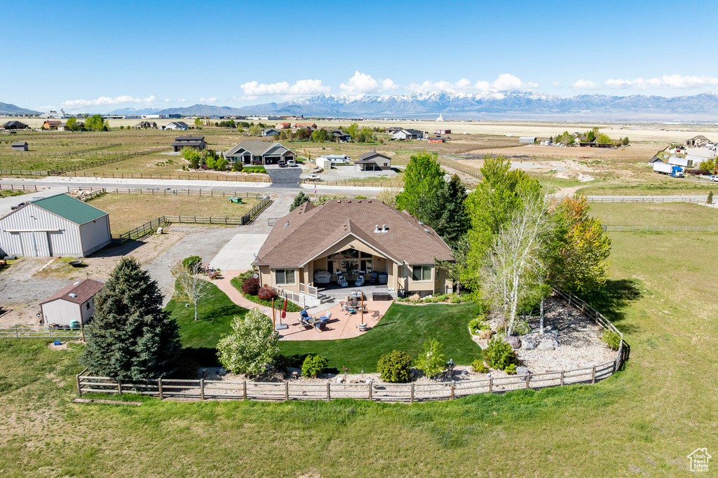 Birds eye view of property with a mountain view and a rural view