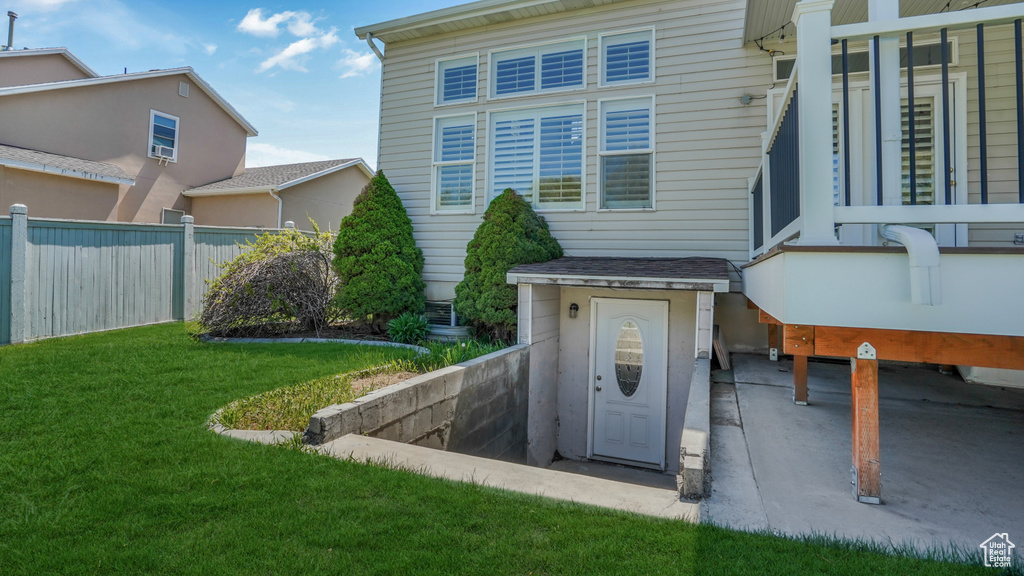 Exterior space with a lawn and fence