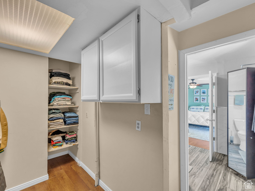 Hall featuring baseboards and light wood-style floors