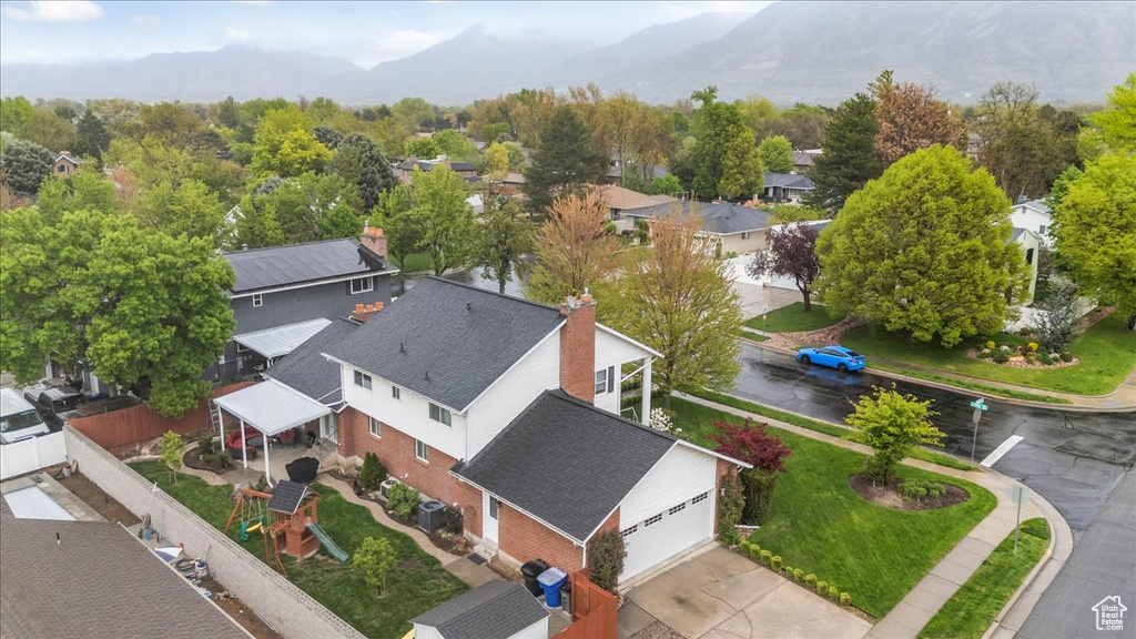 Birds eye view of property with a residential view and a mountain view