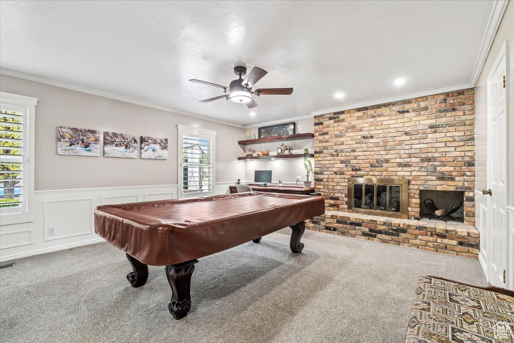 Recreation room with crown molding, carpet flooring, a ceiling fan, and pool table