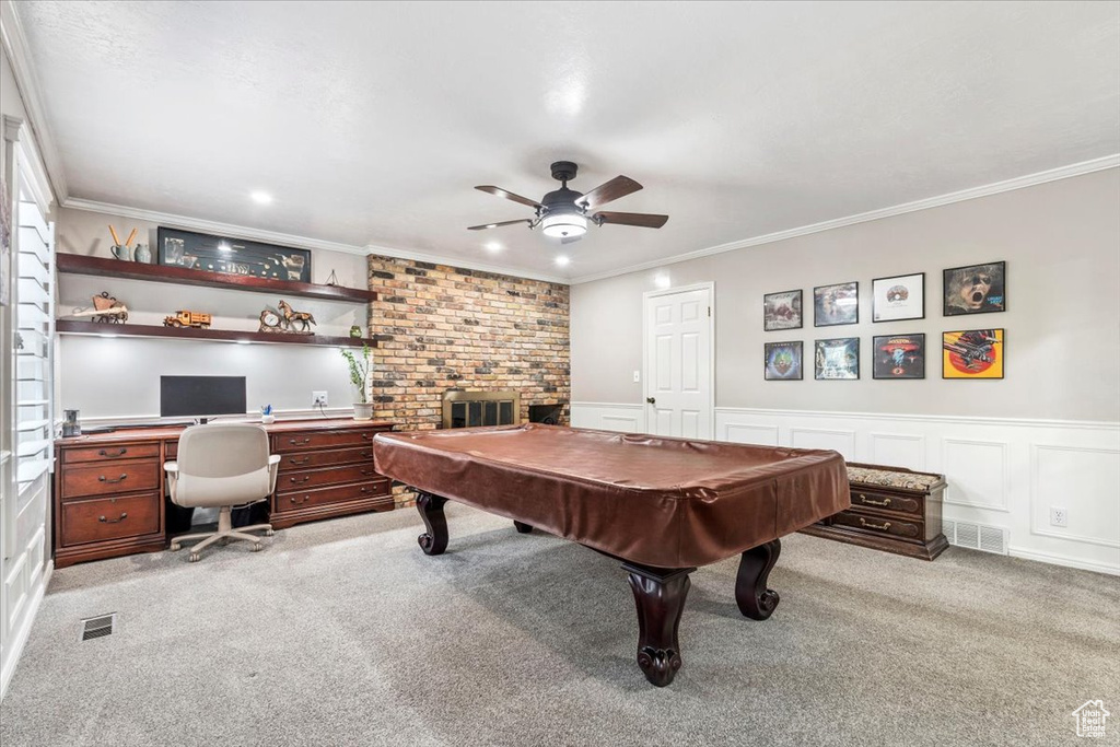 Playroom featuring crown molding, visible vents, a ceiling fan, and light colored carpet