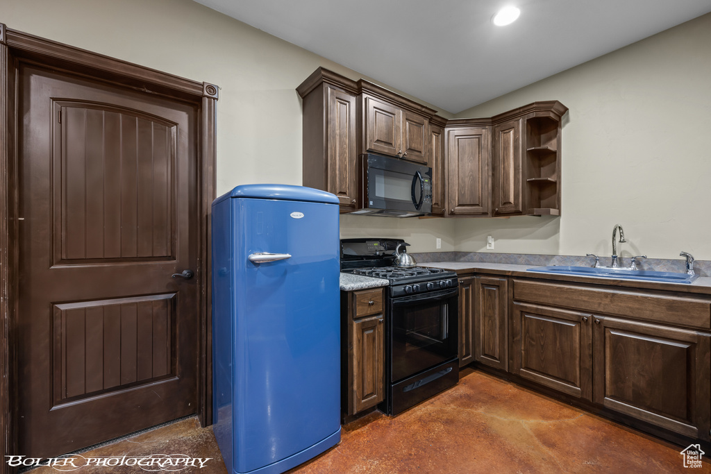 Kitchen featuring open shelves, dark brown cabinets, finished concrete floors, a sink, and black appliances