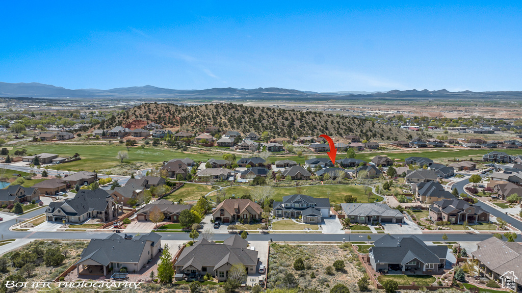 Drone / aerial view with a residential view and a mountain view
