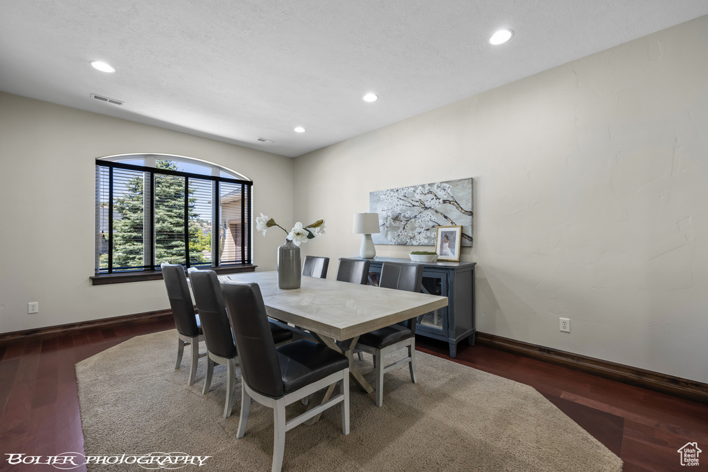 Dining room with baseboards, recessed lighting, and wood finished floors