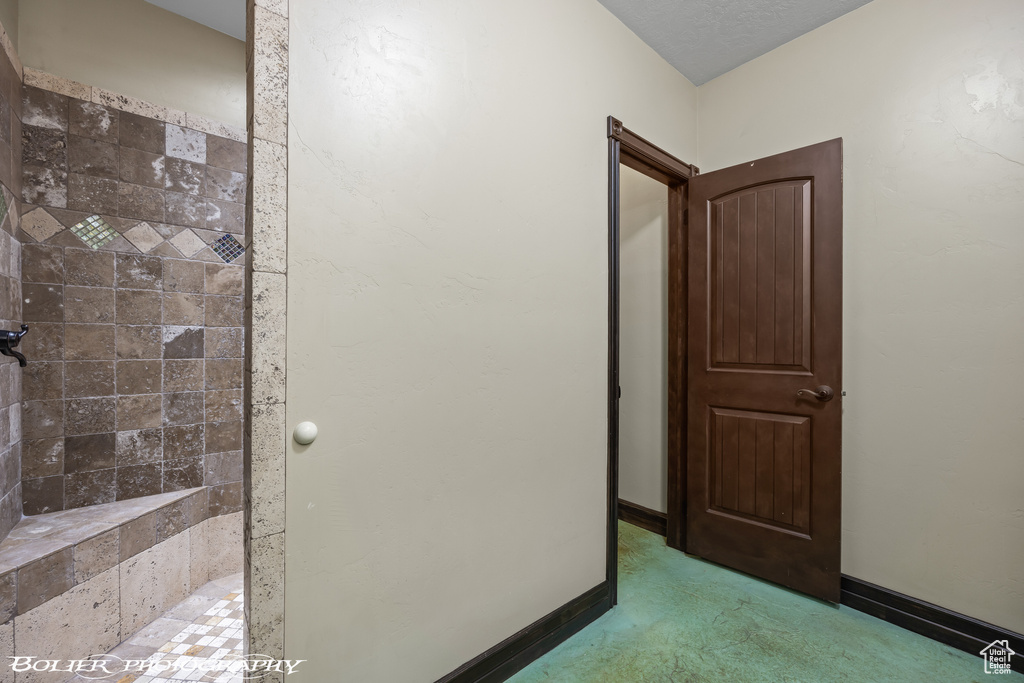Full bathroom with tiled shower