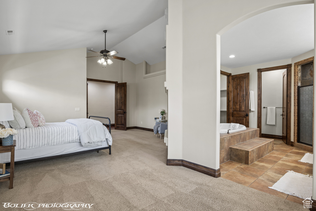 Bedroom featuring carpet flooring, arched walkways, recessed lighting, baseboards, and vaulted ceiling