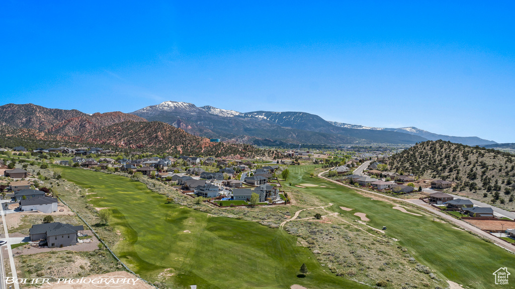 Property view of mountains featuring a residential view and golf course view
