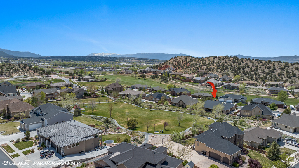 Birds eye view of property featuring a mountain view and a residential view