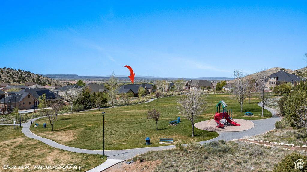 View of home\\\\\\\\\\\\\\\'s community featuring a lawn, a residential view, and playground community