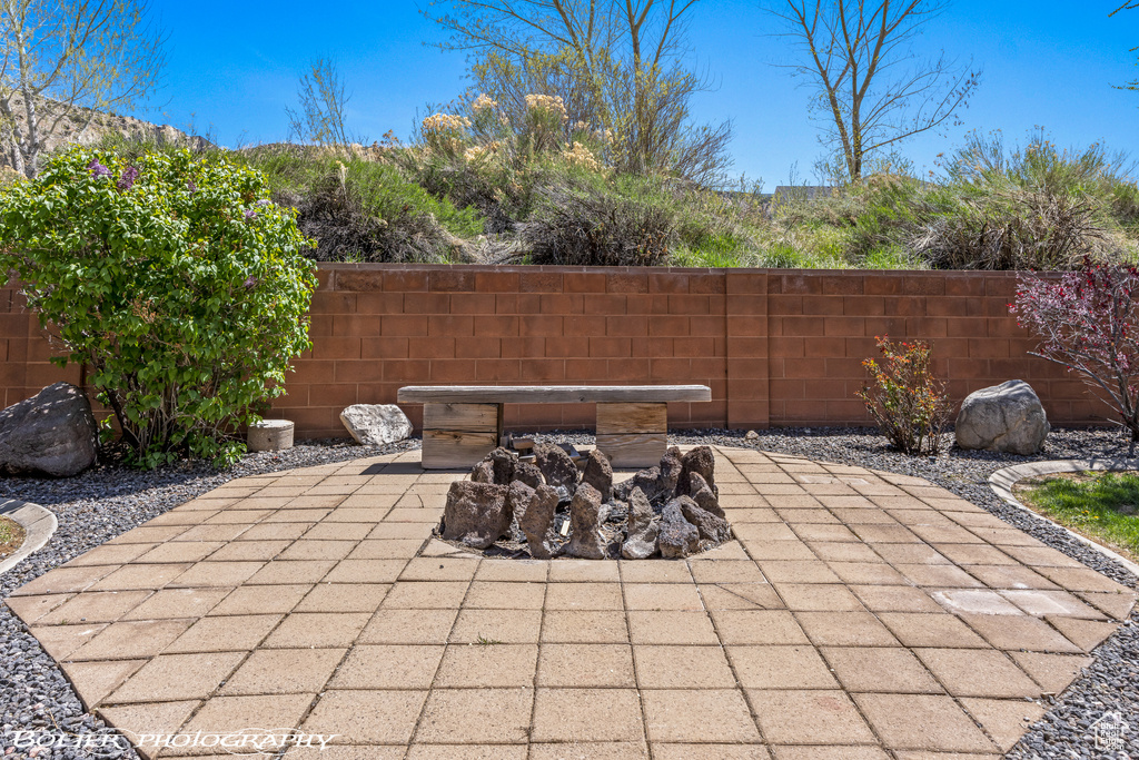 View of patio with fence