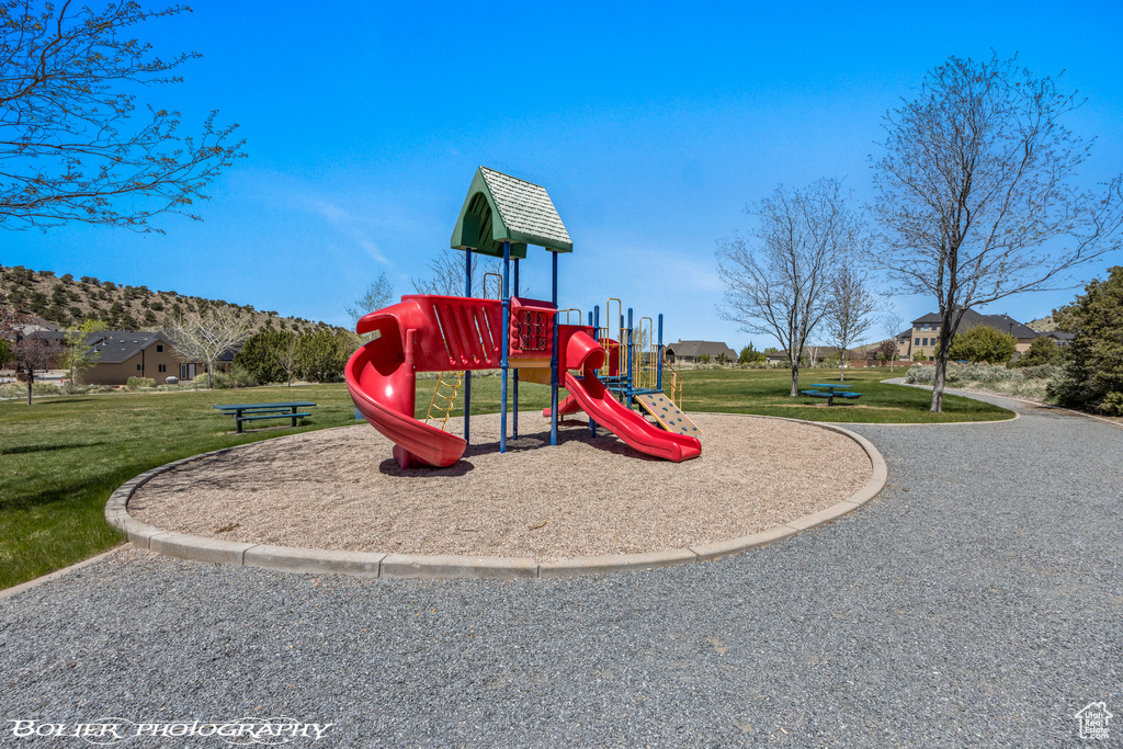 Community jungle gym featuring a yard