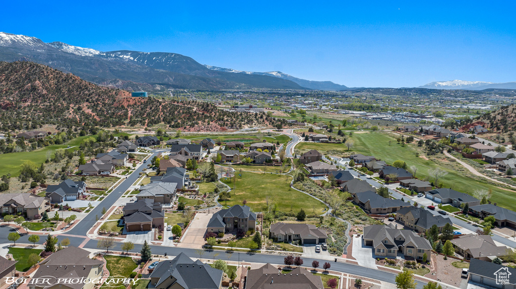 Aerial view with view of golf course, a mountain view, and a residential view