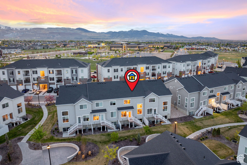 Birds eye view of property with a residential view and a mountain view