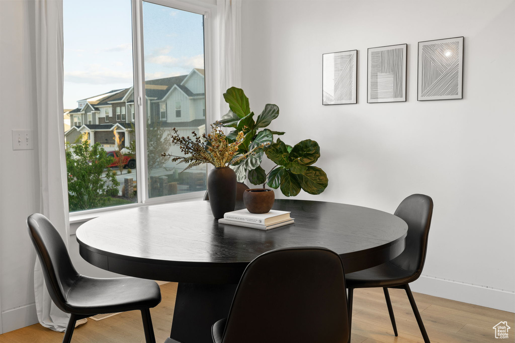 Dining room featuring baseboards and light wood-type flooring