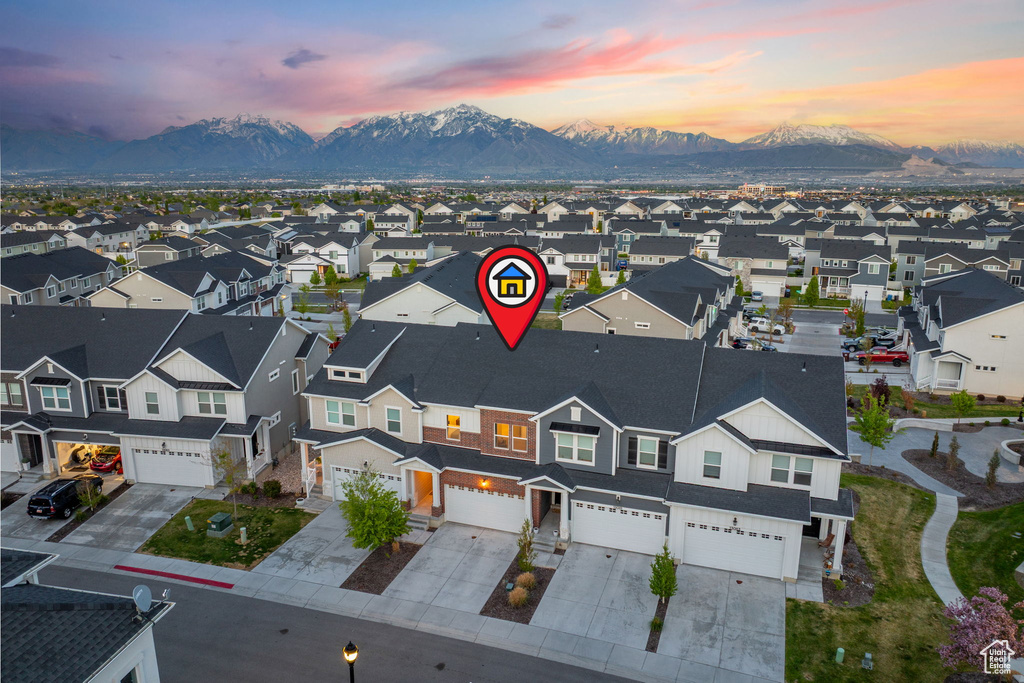 Aerial view at dusk with a residential view and a mountain view