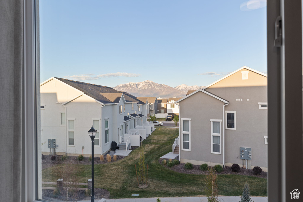 Exterior space with a residential view and a mountain view