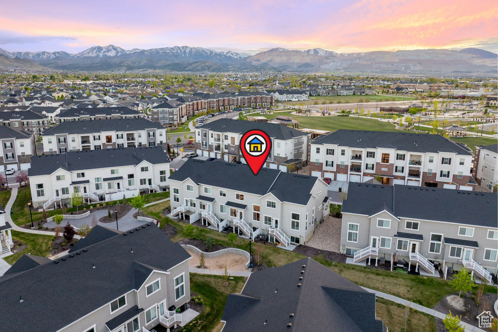 Birds eye view of property with a mountain view