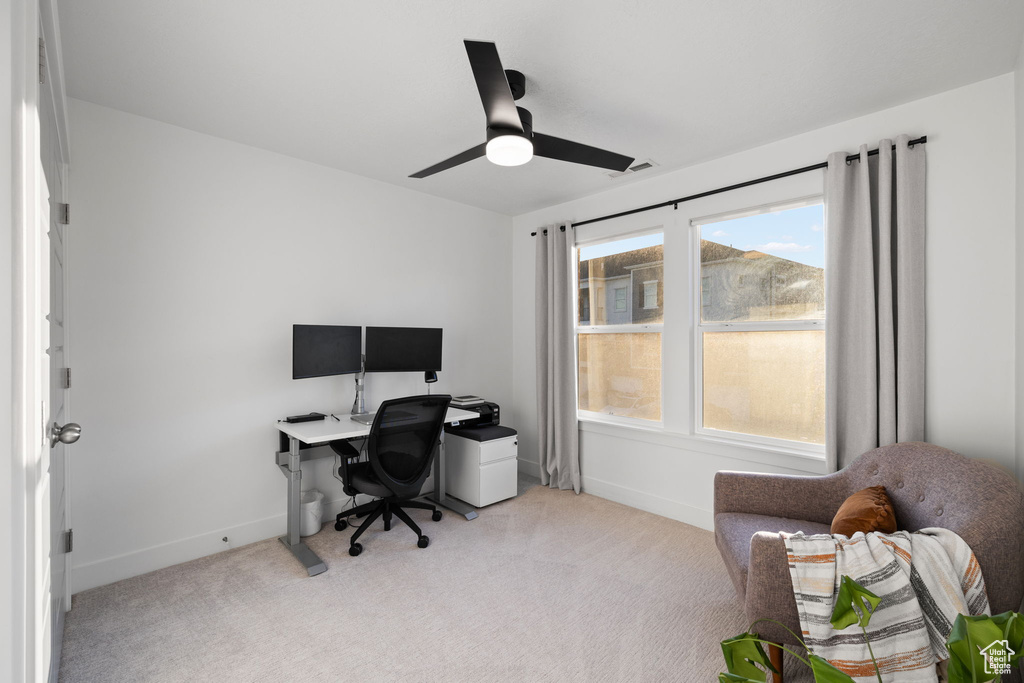 Office area with baseboards, a ceiling fan, carpet flooring, and visible vents