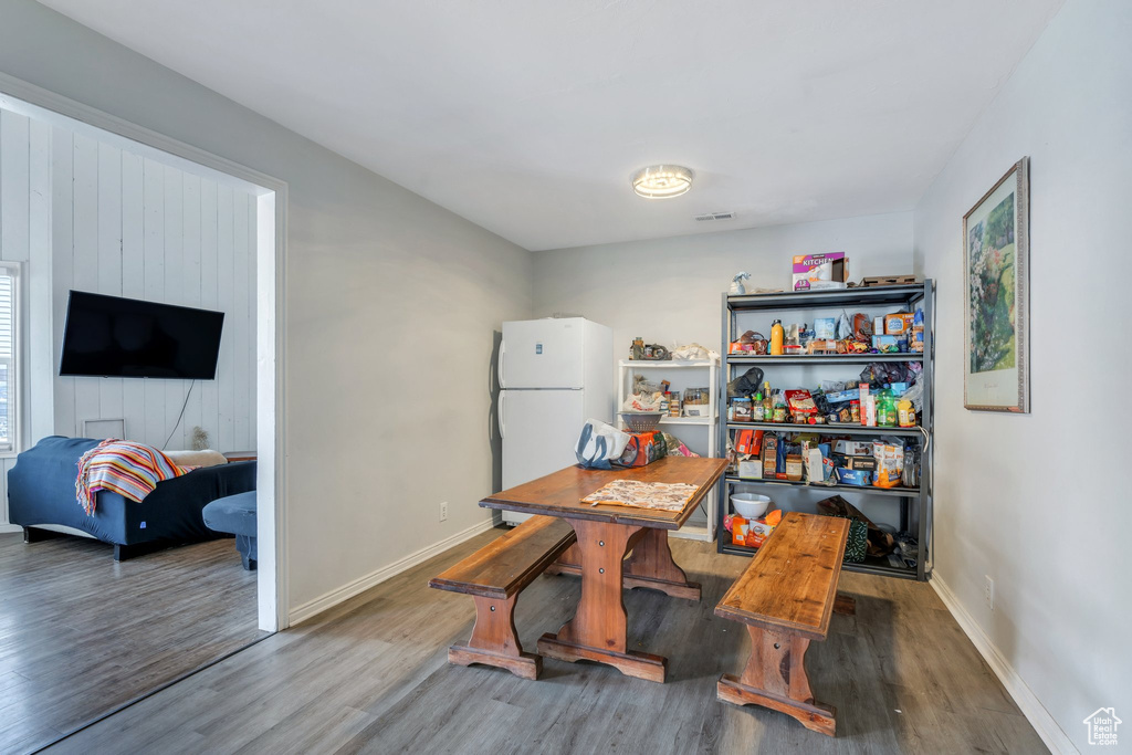 Dining area with baseboards and wood finished floors