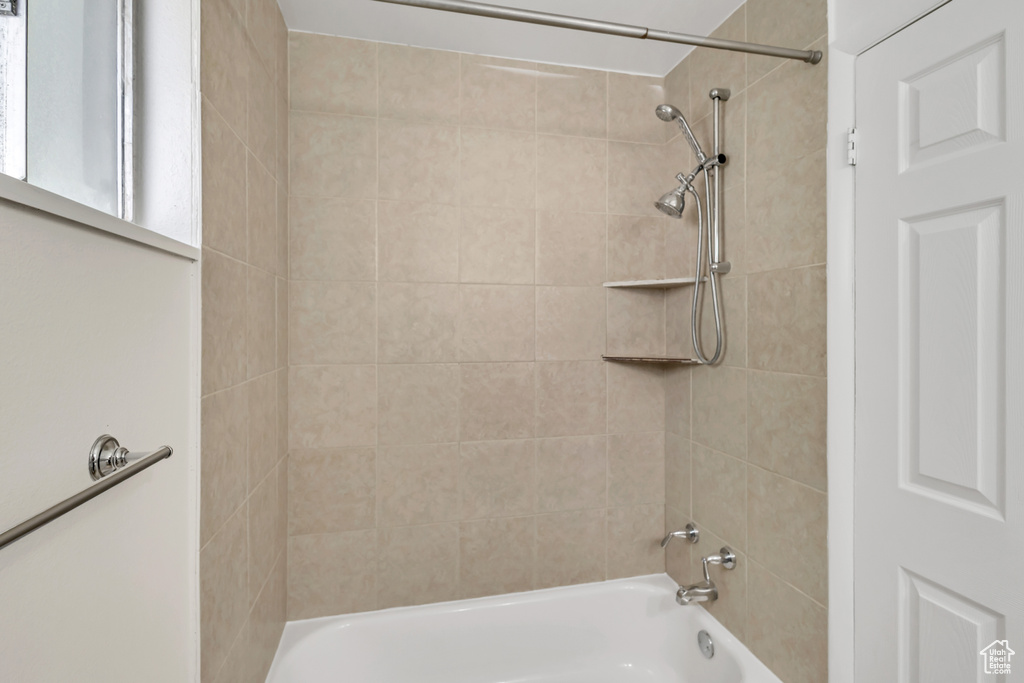 Full bath featuring shower / bath combination