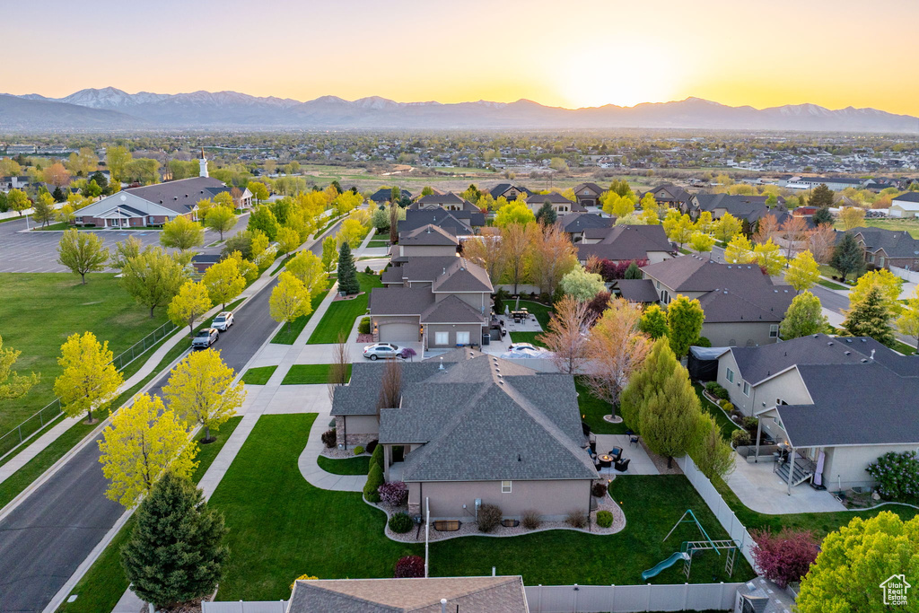 Aerial view at dusk with a residential view and a mountain view