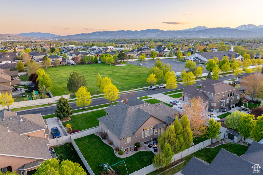 Aerial view at dusk featuring a residential view and a mountain view