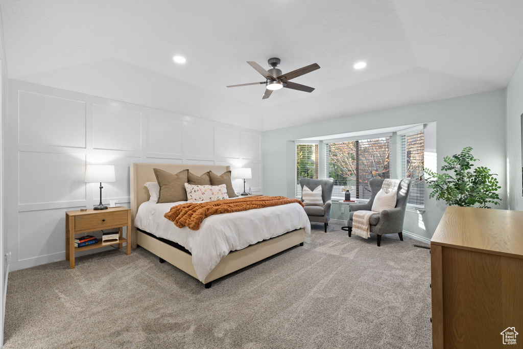 Bedroom with ceiling fan, light carpet, a decorative wall, and recessed lighting