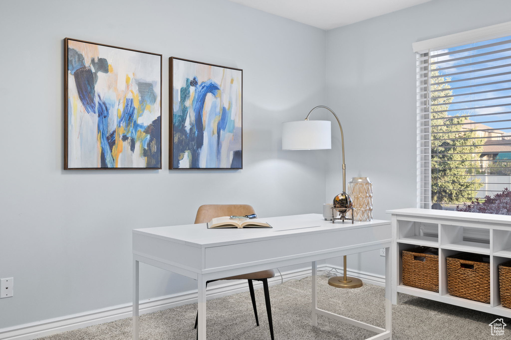 Carpeted office featuring baseboards